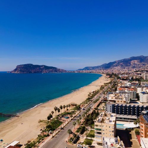 view-beach-city-agia-pedrera-background